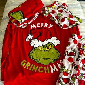 One women’s medium and one men’s large Christmas pj set with a small dog set too